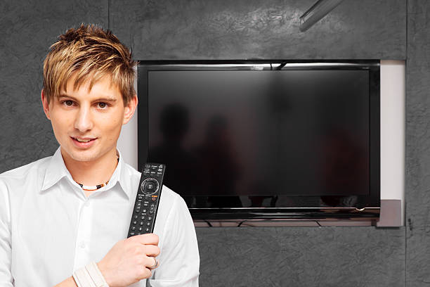 young man with modern tv set